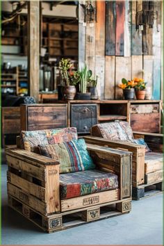 two wooden chairs sitting next to each other on top of a cement floor with plants in the background