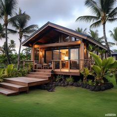 a small house with steps leading up to the front door and covered in wood, surrounded by palm trees