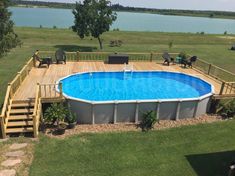 an above ground swimming pool with deck and stairs