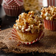 some popcorn cupcakes are sitting on a table