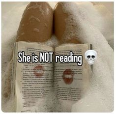 an open book with the words she is not reading on it and a skull sticking out of