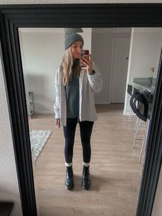 Girl standing in front of mirror wearing zara shirt jacket with a classic pair of leggings, turtleneck sweater, a beanie and platform Doc Martens Leggings And Doc Martens Outfit Winter, Outfits With Leggings And Doc Martens, Dr Martens And Leggings Outfit, Docs Winter Outfit, Black Dock Martins Outfits, Doc Martens Outfit Winter Leggings, Docs And Socks, Legging Doc Martens Outfit