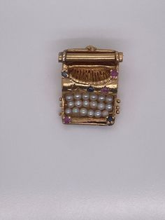 Vintage 14k yellow gold typewriter charm. The charm has 3 rows of pearls and genuine rubies and sapphires - 1 stone is missing. The charm weighs 7.81 grams of gold. Silly Shoes, Metal Smithing, Family Jewels, Manifestation Board, Small Charms, Charm Necklaces, Dec 12, Boston Ma, Precious Gems