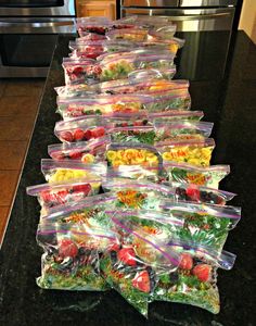 frozen smoothie packs lined up on a kitchen counter with the words frozen smoothie packs