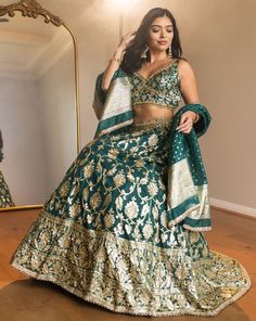 Bright green lehenga with silver and gold brocade work. Paired with a brocade blouse and dupatta with hand-embroidery DELIVERY TIMEPlease allow 1 week for your outfit to be dispatched. Professional cleaning only. Green Raw Silk Choli With Intricate Embroidery, Green Chanderi Choli With Intricate Embroidery, Green Lehenga With Cutdana And Kundan, Bollywood Green Lehenga With Intricate Embroidery, Green Lehenga With Intricate Embroidery For Festive Occasions, Festive Green Lehenga With Intricate Embroidery, Green Raw Silk Choli With Dupatta, Green Chanderi Lehenga With Zari Work, Bollywood Style Brocade Sets With Zari Work