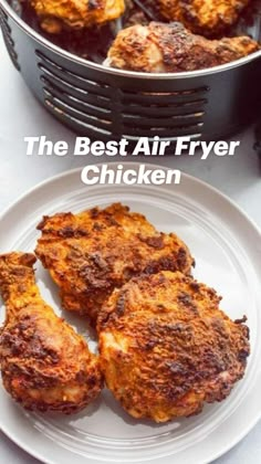 the best air fryer chicken on a white plate next to a pan full of fried chicken