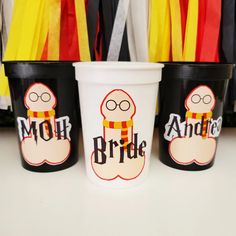 three black and white cups with the words bride and groom on them are sitting next to each other