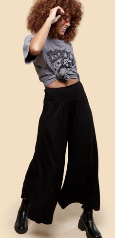 Versatile Summer Yoga Pants With Elastic Waistband, Bohemian Black Pants, Trendy Black Wide Leg Yoga Pants, Black Elastic Waistband Culottes For Spring, Black Wide Leg Culottes For Summer, Black Wide Leg Summer Culottes, Solid Wide-leg Yoga Pants For Summer, Black Wide-leg Culottes For Summer, Solid Wide-leg Summer Yoga Pants