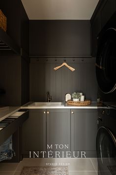 an image of a laundry room setting with washer and dryer in the foreground