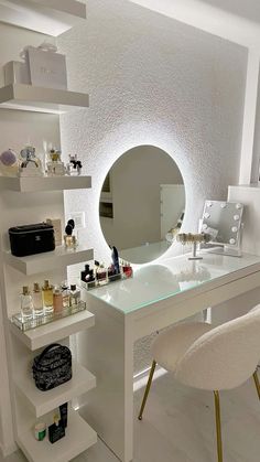 a white desk topped with a mirror and lots of bottles