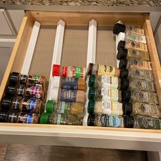 an organized spice drawer with spices and seasonings