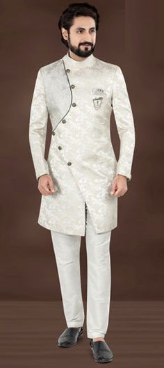 Silver color IndoWestern Dress in Jacquard fabric with Embroidered, Resham, Sequence, Thread work White Festive Ceremony Dress, Festive White Ceremony Dress, White Brocade Kurta For Wedding, White Brocade Sherwani For Festive Occasions, White Brocade Wedding Kurta, Festive White Brocade Kurta, White Long Sleeve Kurta For Reception, Festive White Brocade Sherwani, Festive White Brocade Dress