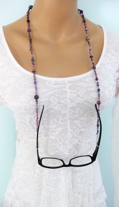 "Purple beaded Glasses Chain, and Glasses Necklace combination hand made by Ralston Originals. This is a unique original style glasses chain, and necklace combination designed by Ralston Originals. Unique from any other glasses chains on Etsy, Ralston Originals was the first to add the lobster clasp at the end of the chain to join together to make a Necklace. Brilliant! This makes it even more unique because you now have two pieces of jewelry in one!! Wear it to work or out shopping as a Necklac Adjustable Chain Glass Beaded Necklaces For Jewelry Making, Bohemian Glass Beaded Chain, Glass Glasses Chains With Colorful Beads For Gifts, Handmade Adjustable Glasses Chains With Round Beads, Colorful Round Beads Glasses Chain As Gift, Handmade Elegant Glasses Chains For Festivals, Adjustable Glass Beaded Necklaces With Wire Wrapping, Purple Glass Glasses Chains As Gift, Adjustable Glass Beaded Necklace With Black Beads