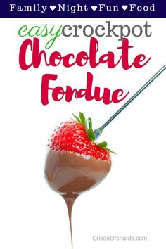 a chocolate fondue with a strawberry on top and the words easy crockpot chocolate fondue