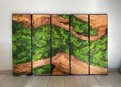 a room divider made out of wood and moss