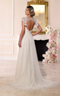 a woman in a wedding dress looking back