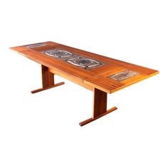 a wooden table with two pictures on the top and one is made out of wood