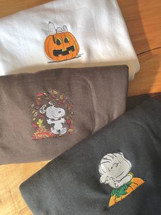 three halloween towels with cartoon characters on them