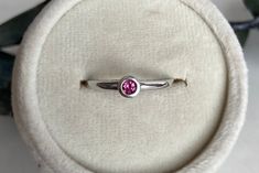 Sterling Silver Round Genuine Pink Tourmaline Bezel Set Ring. One round 0.15 ct genuine pink tourmaline. In-stock items will ship within one week.Out-of-stock items will ship within two-three weeks.Call or text for availability. 630-100 Stone Genuine Pink Tourmaline Birthstone October Anniversary 45th Metal Sterling Silver Tourmaline Birthstone Ring With Bezel Setting, Oval Pink Tourmaline Ring, Pink Tourmaline Rings For Gift, Red Tourmaline Fine Jewelry Rings, Pink Tourmaline Ring Silver, Pink Tourmaline Ring, Bezel Set Ring, Set Ring, Tourmaline Ring