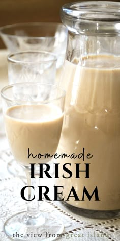 homemade irish cream in a glass pitcher and two glasses on a lace tablecloth with text overlay that reads homemade irish cream