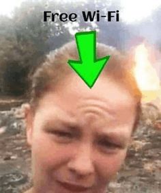 a man with a green arrow pointing to the left and an image of a fire in the background that says free wi - fi