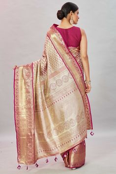 Look royal at weddings and special occasions in this golden pink heavy kanchipuram saree. It comes with a blouse piece. Disclaimer: The shown stitched blouse on the model is for display purpose only. The saree comes with a matching blouse piece and finished with fall and piko. Gold Chandbali Pre-draped Saree For Diwali, Diwali Gold Pre-draped Chandbali Saree, Gold Pre-draped Saree With Cutdana In Jamawar, Pink Bollywood Pre-draped Saree With Meenakari, Gold Pre-draped Jamawar Saree With Zari Work, Gold Banarasi Silk Choli With Zari Work, Gold Anarkali Pre-draped Saree In Art Silk, Gold Pre-draped Chandbali Saree For Festivals, Transitional Pink Saree With Zari Work