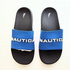 Finish Off A Summer Look With The Yavo Slide Sandal From Nautica. This Pair Is A Classic, Traveling From The Pool To The Beach, Or Wherever You Go, With Ease Features Synthetic Upper Slip-On Round Open Toe Synthetic Lining Eva Sole Imported Brand New Without Box Blue Flip Flops For Beach Season, Casual Blue Slides For Swimming, Blue Flip Flops For Swimming And Beach Season, Blue Flip Flops For Swimming During Beach Season, Comfortable Blue Sport Sandals For Vacation, Sporty Blue Sandals For Swimming, Navy Synthetic Slides For Beach, Blue Sporty Sandals For Beach, Blue Sporty Flip Flops For Vacation