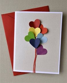 a card with paper hearts attached to it