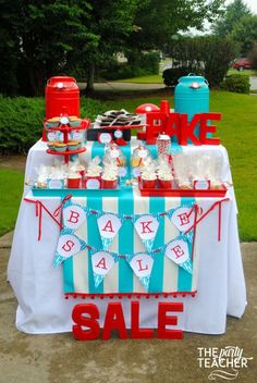 the party table is decorated with blue and red decorations