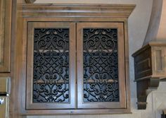 an ornate wooden cabinet in a kitchen