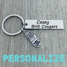 a keychain with the name casey bhs cougars on it