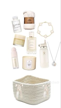 the contents of a white basket are arranged on top of each other, including perfumes and