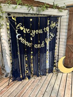 a stage set up with curtains, moon and stars