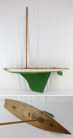 an old wooden paddle boat with green paint on the bottom, and a new one in the back