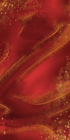 an abstract red and gold background with sparkles