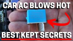 a hand holding a small blue device in it's left hand with the words car ac blows hot how to fix it