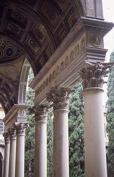 an ornate building with columns and arches