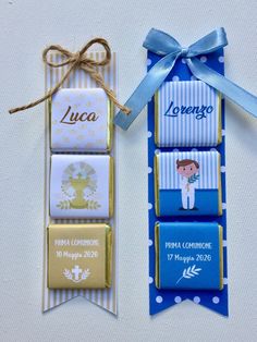 two tags tied to each other with blue ribbons