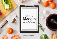 a clipboard with the words cooking mockup on it surrounded by vegetables and spices