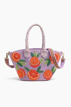 Mini tote Hand-held straps Hand embellished front with bright tangerines Embroidered lace detail on the straps Long adjustable crossbody strap Top zip closure Made in hand-woven jacquard Fully lined interiors with zip pocket Size :15" x 7.5" x 4.5" The Florida Lavendar Handbag is the perfect accessory for any outfit. Its hand-held straps and adjustable crossbody strap make it easy to carry around. The bright tangerines on the front are hand-embellished and the embroidered lace detail on the straps adds a unique touch. The hand-woven jacquard bag is fully lined with an interior zip pocket for extra storage. With its stylish and functional design, this handbag is sure to turn heads wherever you go. The adorable shape and intricate embellishments will have you swooning over tis cutie and carr Beaded Jewels, Embroidered Bag, Orange Bag, Strap Top, Mini Tote, Strap Tops, Pocket Size, Embroidered Lace, Hand Beading