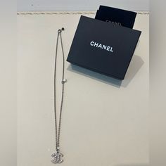 Chanel Cc Logo Silver Chain Long Necklace Two Pearl Like Details On The Chain (Black& White) Long Style Length 12.25in Short Style Length 8.5in Chanel Logo Size .5in Very Good Condition Chanel Necklace Dust/Box Logo Necklace, Chanel Necklace, Chanel Logo, Chanel Jewelry, Long Style, Cc Logo, Long Necklace, Silver Chain, Chanel