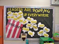 a classroom bulletin board with flowers and popcorn bags on it that says, leaders are popping up everywhere