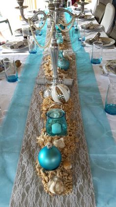 a long table with blue and white decorations on it