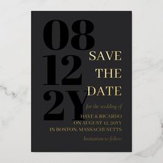 black and gold save the date card on a white marble surface with text that reads, save the date