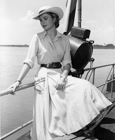 an old photo of a woman on a boat