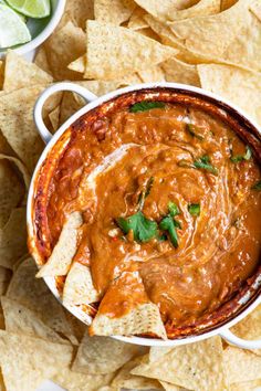 a white bowl filled with salsa and tortilla chips on top of a table