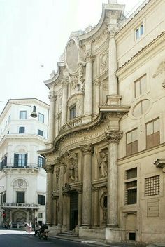 an old building on the corner of a street