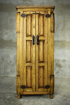 an old wooden cabinet with two doors