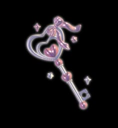 a pink key with hearts and stars on it