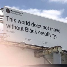 a large billboard on the side of a building that says, this world does not move without black creativity